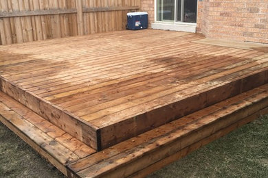 This is an example of a backyard landscaping in Toronto with decking for summer.