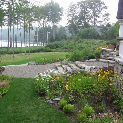 Photo of a traditional backyard gravel landscaping in Manchester.