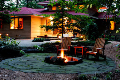 This is an example of a craftsman landscaping in Grand Rapids with a fire pit.
