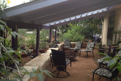 This is an example of a medium sized world-inspired back patio in Austin.