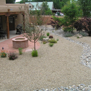 Xeriscape Backyard w/ Flagstone Fire Pit & Dry River Bed for Drainage Control