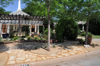 Inspiration for a small eclectic drought-tolerant and full sun front yard stone landscaping in Dallas for spring.