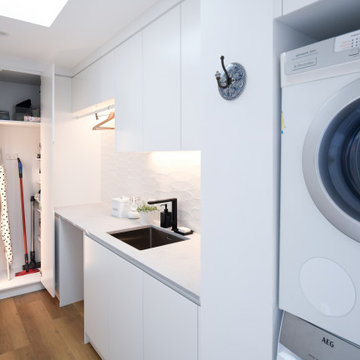 Laundry with corner cupboard