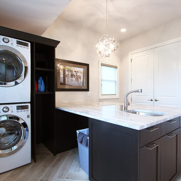 Basket Storage with Stacked Washer and Dryer in Large Laundry Room