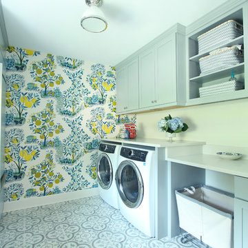 Blue Cabinets in Bright Laundry Room with Cement Tile
