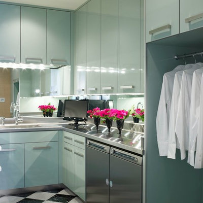 Laundry room - contemporary laundry room idea in Miami with flat-panel cabinets, blue cabinets, a side-by-side washer/dryer and stainless steel countertops