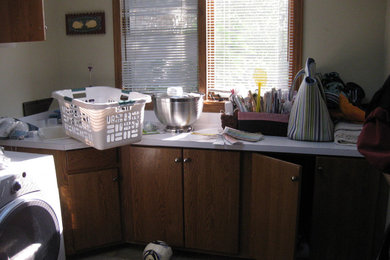 Example of a transitional laundry room design in Denver