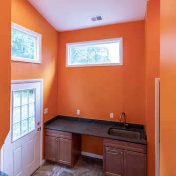 Cheerful Multi Level Rear Addition to Expand Kitchen, Mudroom & Sunroom in Oakt