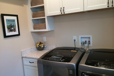 Inspiration for a small timeless galley vinyl floor dedicated laundry room remodel in DC Metro with a single-bowl sink, beaded inset cabinets, white cabinets, beige walls and a side-by-side washer/dryer