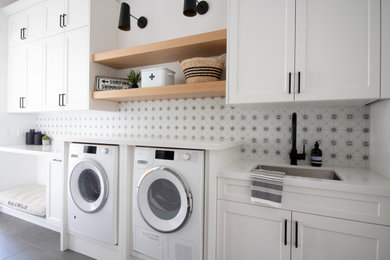 Inspiration for a coastal laundry room remodel in San Diego