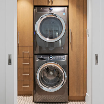 Contemporary custom walnut wood laundry cabinetry