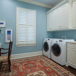 Utility room - mid-sized traditional galley dark wood floor and brown floor utility room idea in Little Rock with an undermount sink, raised-panel cabinets, white cabinets, quartz countertops, blue walls and a side-by-side washer/dryer