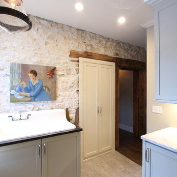 Exposed Stone Wall with Original Timber Doorway in Farmhouse Laundry Room