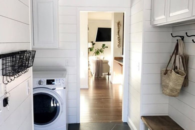 Example of a cottage laundry room design in Seattle