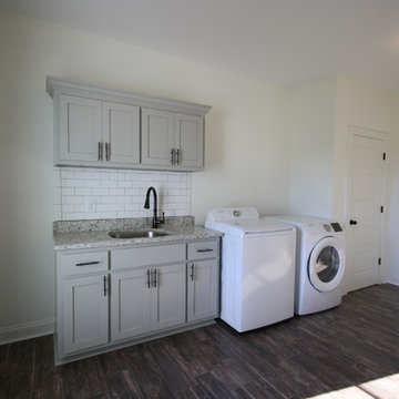 Farmhouse in Jefferson - laundry room with grey shaker cabinets