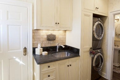 Tuscan laundry room photo in Denver