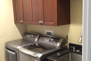 Example of a transitional laundry room design in Tampa