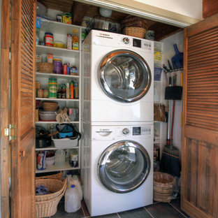 Laundry closet - small traditional laundry closet idea in Philadelphia with a stacked washer/dryer