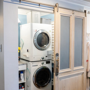 Inspiration for a small single-wall porcelain tile and brown floor laundry closet remodel in New Orleans with granite countertops, a stacked washer/dryer and gray countertops