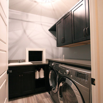 Grey Stained Compact Laundry Room with Bold Tile Floor
