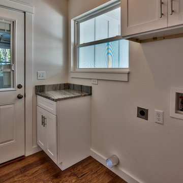 Island Lane - After - Laundry room with additional storage, half light door into