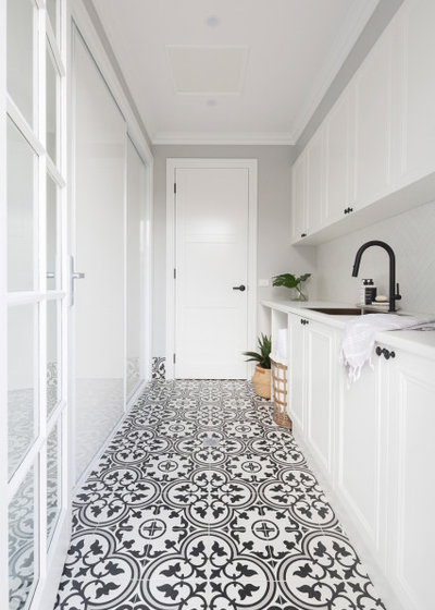 Traditional Laundry Room by Studio Black Interiors