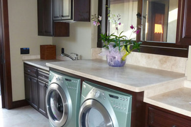 Laundry room - large laundry room idea in San Francisco with dark wood cabinets, granite countertops and a side-by-side washer/dryer