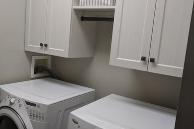 Inspiration for a modern laundry room remodel in Edmonton
