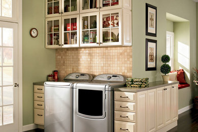 Laundry room - traditional brown floor laundry room idea in DC Metro with beige cabinets and beige countertops