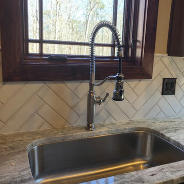 Laundry Room Sink - Traditional Custom Home with Tudor Accents