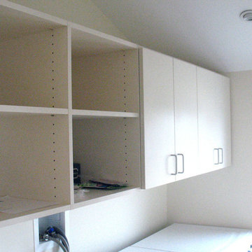 Laundry room storage above washer and dryer