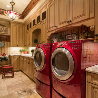 Dedicated laundry room - large mediterranean single-wall travertine floor and brown floor dedicated laundry room idea in Salt Lake City with raised-panel cabinets, medium tone wood cabinets, granite countertops, beige walls and a side-by-side washer/dryer
