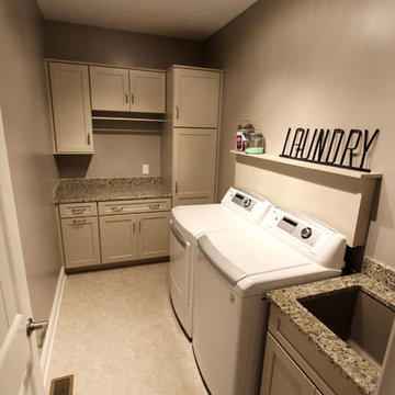 Laundry Room w/ Chai Latte Classic Paint Cabinets and Giallo Traversella Granite