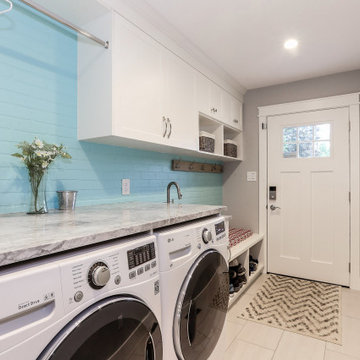 Laundry Room with Drying Rod, Counter for Folding, and Bench Seat with Cubbies