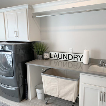 Laundry Room With Front Loaders and Hang Rod