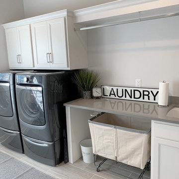 Laundry Room With Front Loaders and Hang Rod