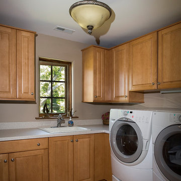 Laundry Room with Maple Cabinets and Solid Surface Countertops