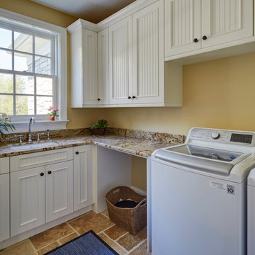 Laundry Room with White Beadboard Cabinetry