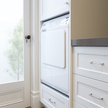 Laundry room with wine storage