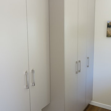 Laundry storage wall with ironing