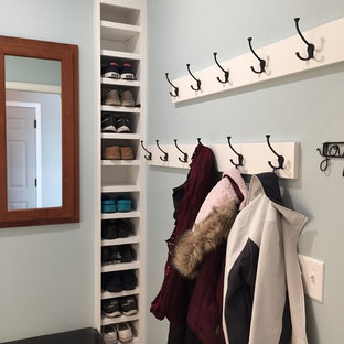 Laundry closet - small transitional single-wall dark wood floor and brown floor laundry closet idea in Minneapolis with an undermount sink, shaker cabinets, white cabinets, quartz countertops, blue walls and white countertops