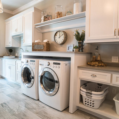 Farmhouse single-wall dedicated laundry room photo in Atlanta with an undermount sink, recessed-panel cabinets, white cabinets, a side-by-side washer/dryer and gray countertops