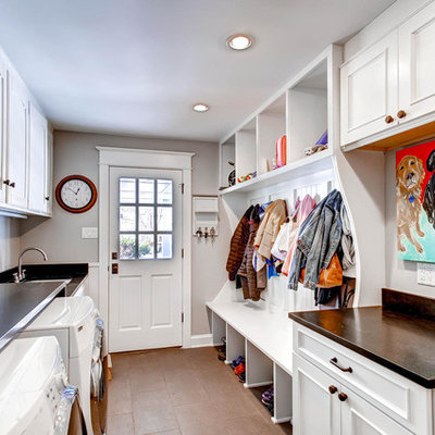 Utility room - traditional galley brown floor utility room idea in Denver with recessed-panel cabinets, white cabinets, gray walls, a side-by-side washer/dryer and brown countertops