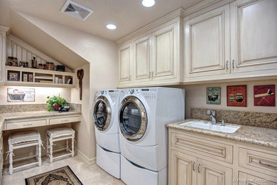 Elegant laundry room photo in Orange County