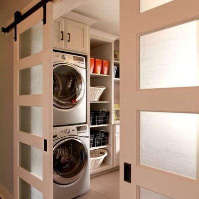 Inspiration for a timeless laundry room remodel in Detroit with a stacked washer/dryer