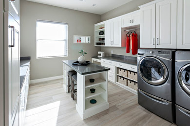 Example of a cottage laundry room design in Phoenix