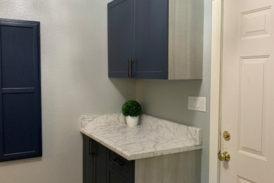Example of a french country laundry room design in Sacramento with beaded inset cabinets and blue cabinets