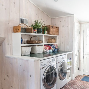 Mudroom/laundry with brick floor