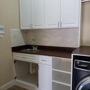New Laundry Room cabinets with sink and backsplash