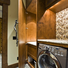 Rustic Laundry Room by Sticks + Stones Design Group Inc.